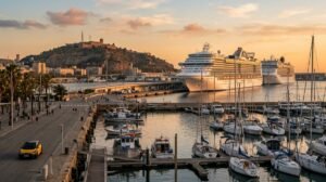 Cruise ships moored at the Moll Adossat pier in Barcelona's port at sunset