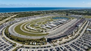 Aerial view of a banked racing oval near the Florida coast in Daytona Beach