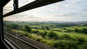 English countryside from a train window heading to a port city