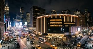 Round Manhattan arena glowing at night