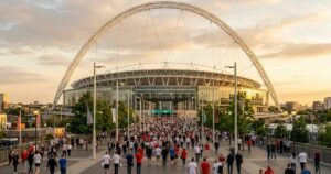 London national stadium with white arch at golden hour
